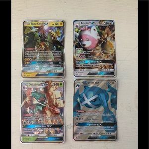 4 Gx Pokémon cards.